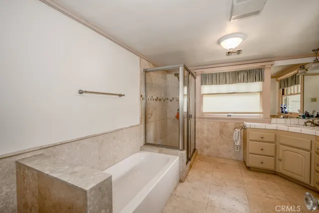 a view of a house with backyard sitting area and garden