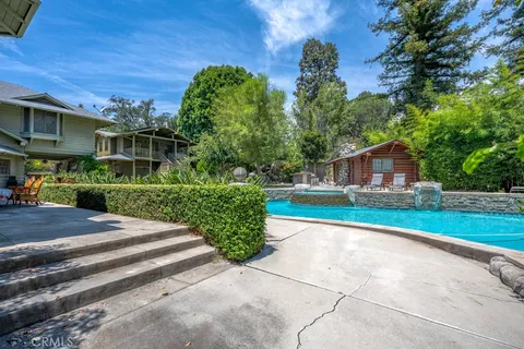 a view of a swimming pool with a patio