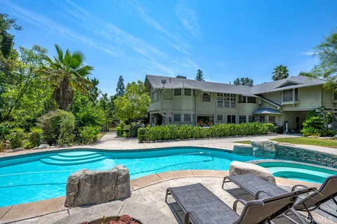 a view of a swimming pool with a patio