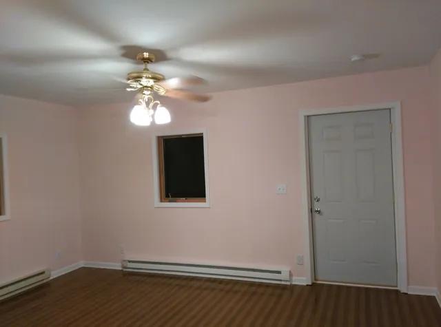 a view of a livingroom with wooden floor