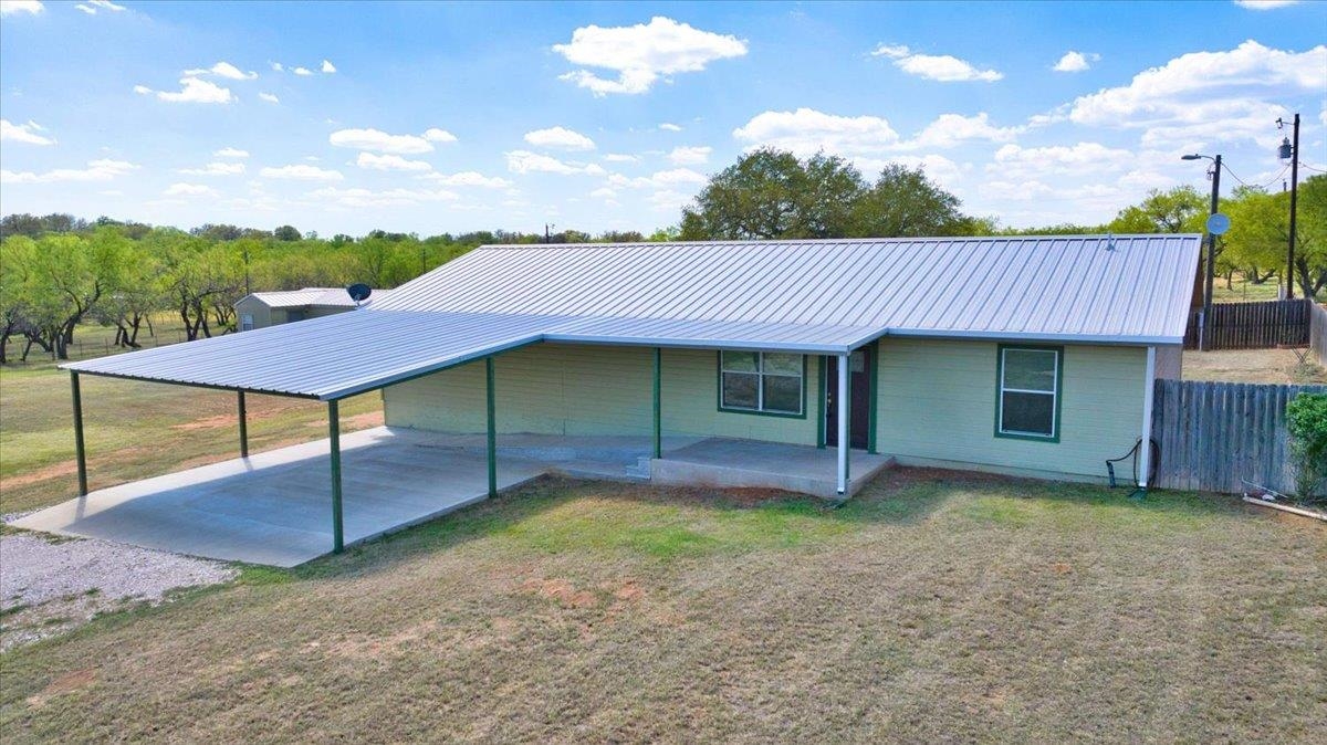 a view of a house with a yard and garage