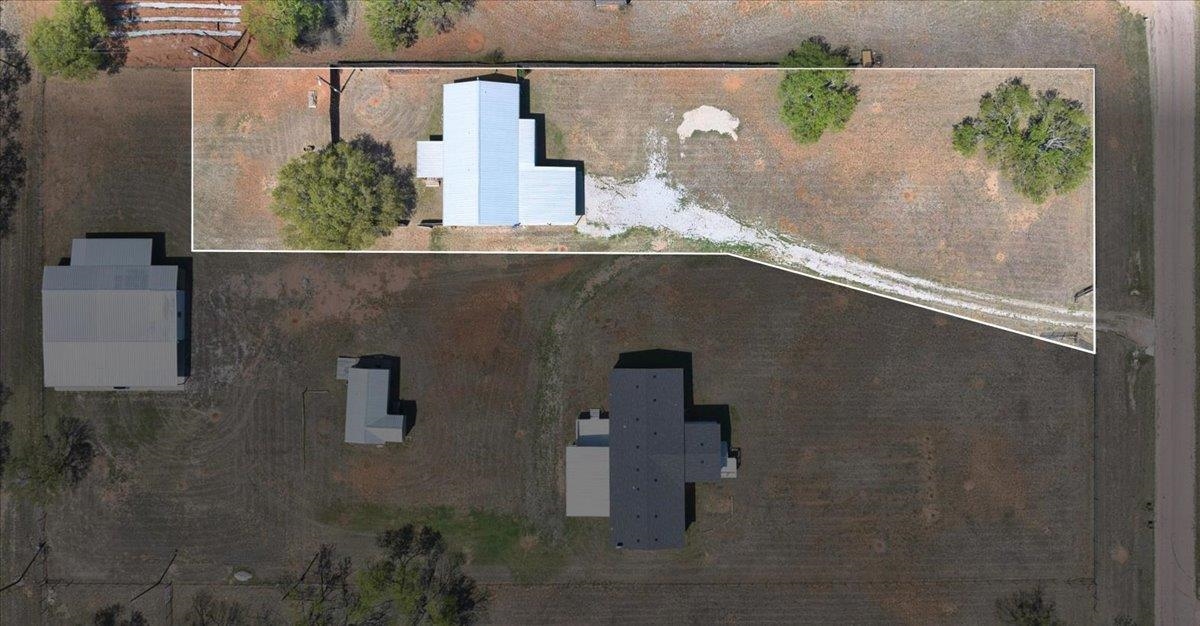 243 East Flag Creek Ranch Road Llano, TX 78643 - Photo 2 of 29 an aerial view of a house with a yard