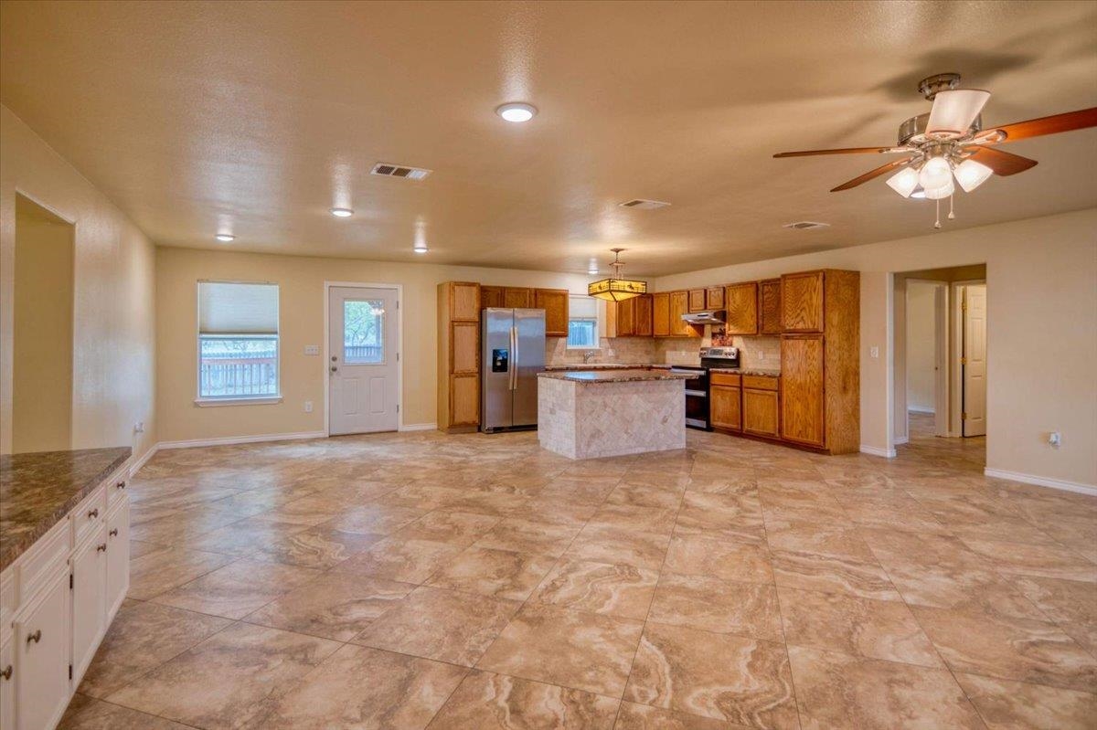 243 East Flag Creek Ranch Road Llano, TX 78643 - Photo 5 of 29 a view of a livingroom with a kitchen