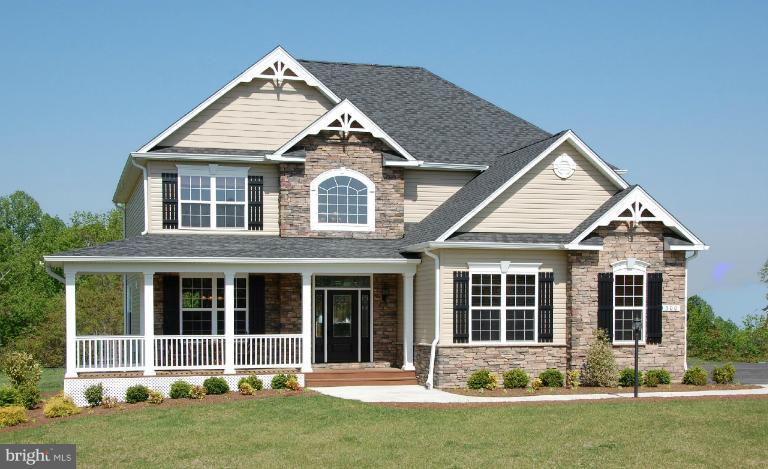 2107 Baythorne Road Prince Frederick, MD 20678 - Photo 4 of 7 front view of a house with a yard