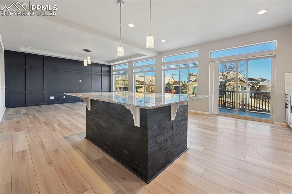 6640 Backcountry Loop Colorado Springs, CO 80927 - Photo 12 of 49 a view of kitchen with cabinets and wooden floor
