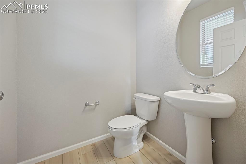 6640 Backcountry Loop Colorado Springs, CO 80927 - Photo 16 of 49 a bathroom with a sink and a toilet