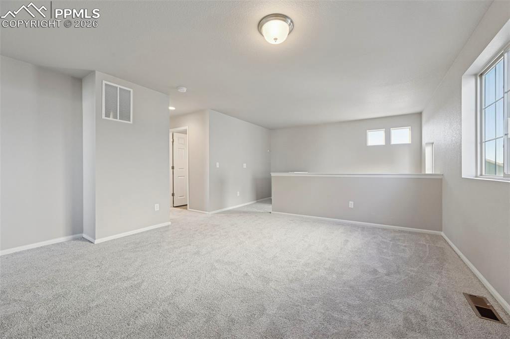 6640 Backcountry Loop Colorado Springs, CO 80927 - Photo 18 of 49 a view of an empty room with a window