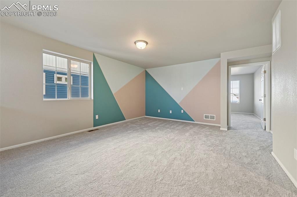 6640 Backcountry Loop Colorado Springs, CO 80927 - Photo 20 of 49 an empty room with windows and entrance