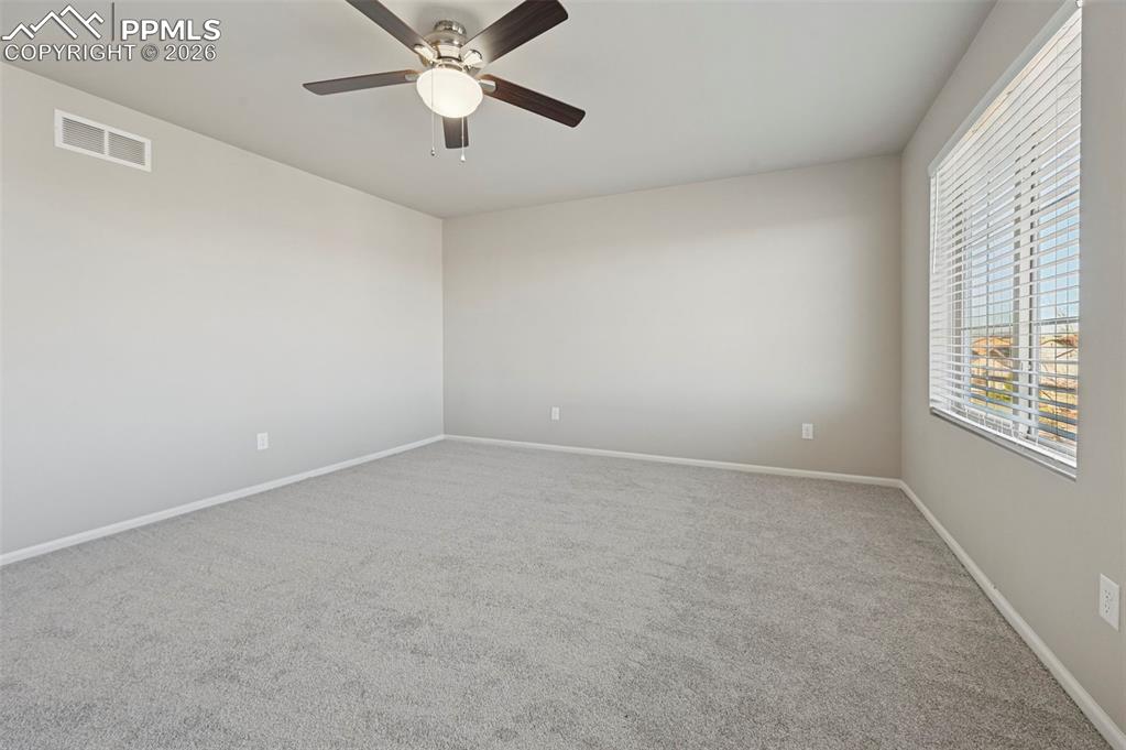 6640 Backcountry Loop Colorado Springs, CO 80927 - Photo 24 of 49 a view of an empty room with a window