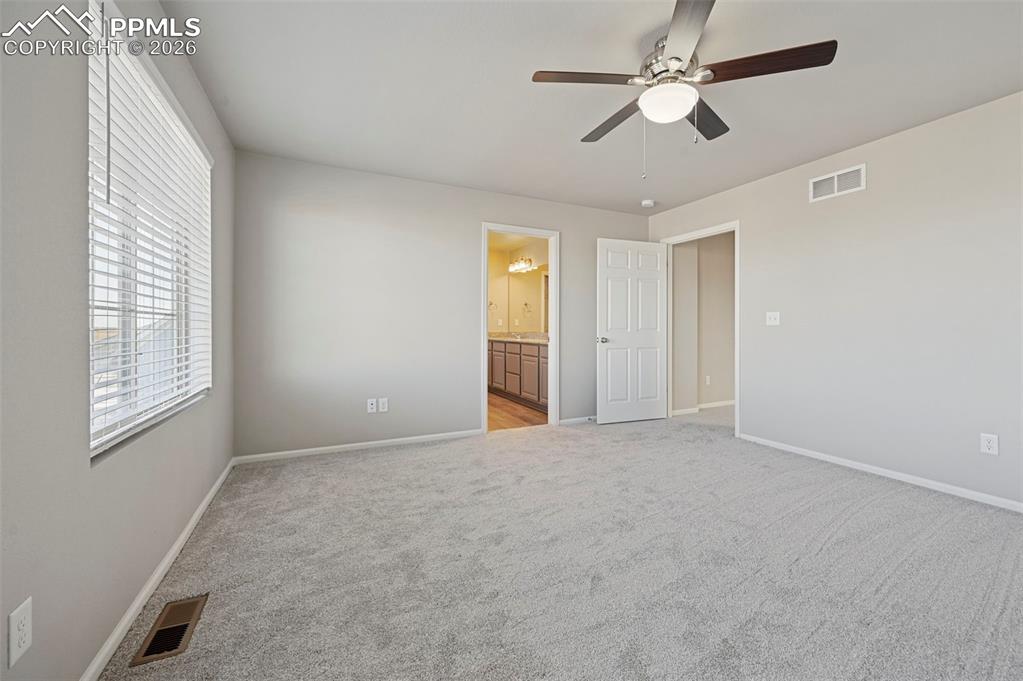 6640 Backcountry Loop Colorado Springs, CO 80927 - Photo 25 of 49 a view of an empty room with a window