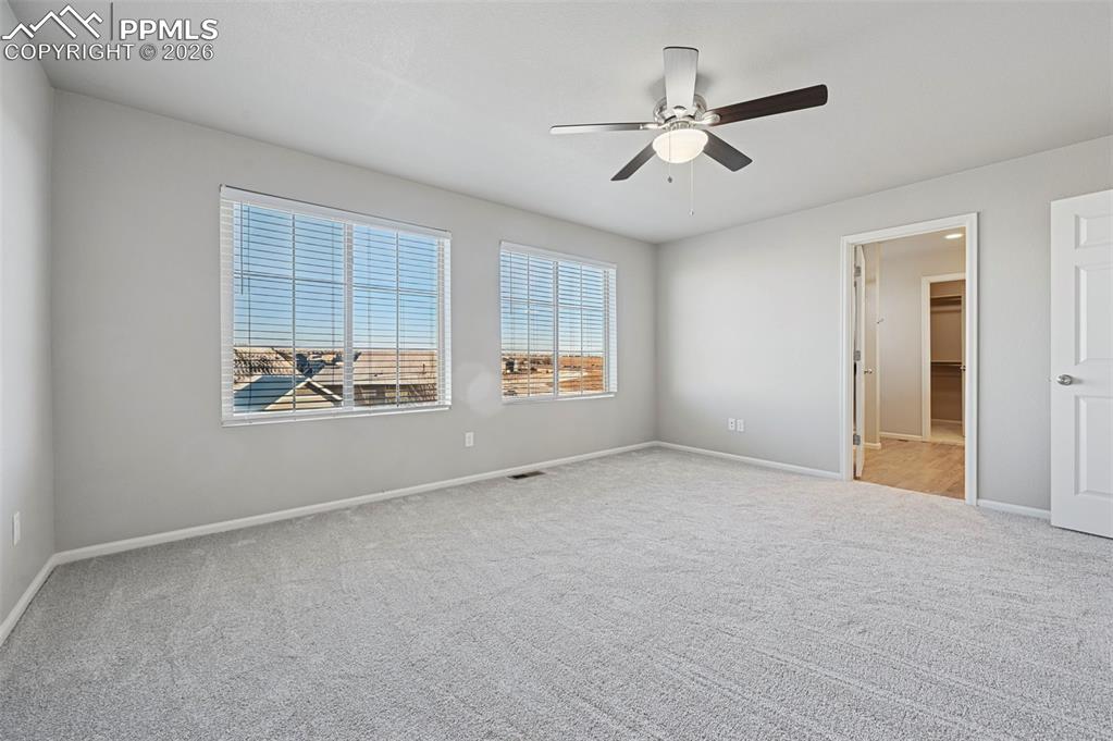 6640 Backcountry Loop Colorado Springs, CO 80927 - Photo 26 of 49 a view of an empty room with a window