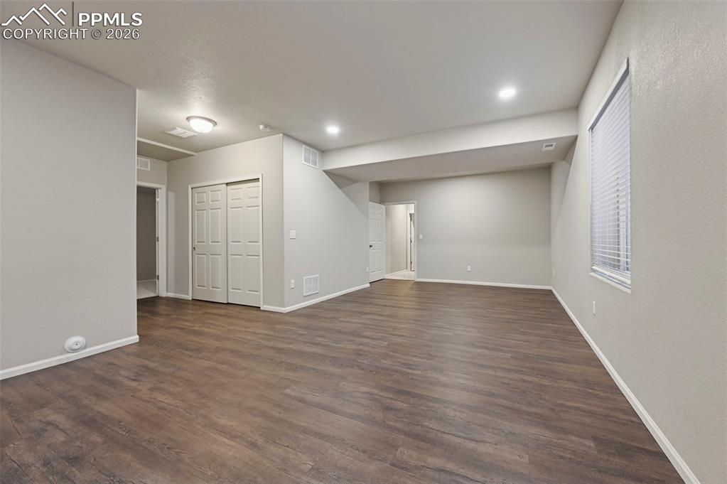 6640 Backcountry Loop Colorado Springs, CO 80927 - Photo 38 of 49 wooden floor in an empty room with wooden floor