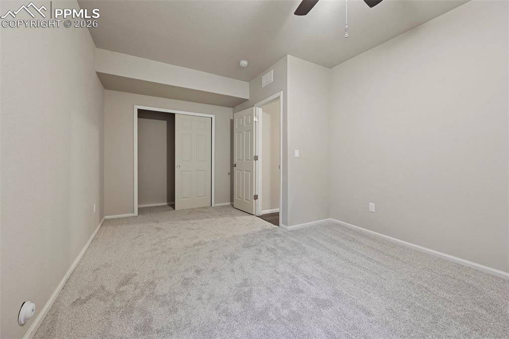 6640 Backcountry Loop Colorado Springs, CO 80927 - Photo 42 of 49 a view of an empty room and chandelier fan