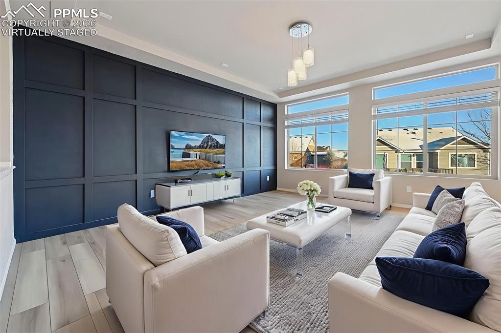 6640 Backcountry Loop Colorado Springs, CO 80927 - Photo 8 of 49 a living room with furniture and a flat screen tv