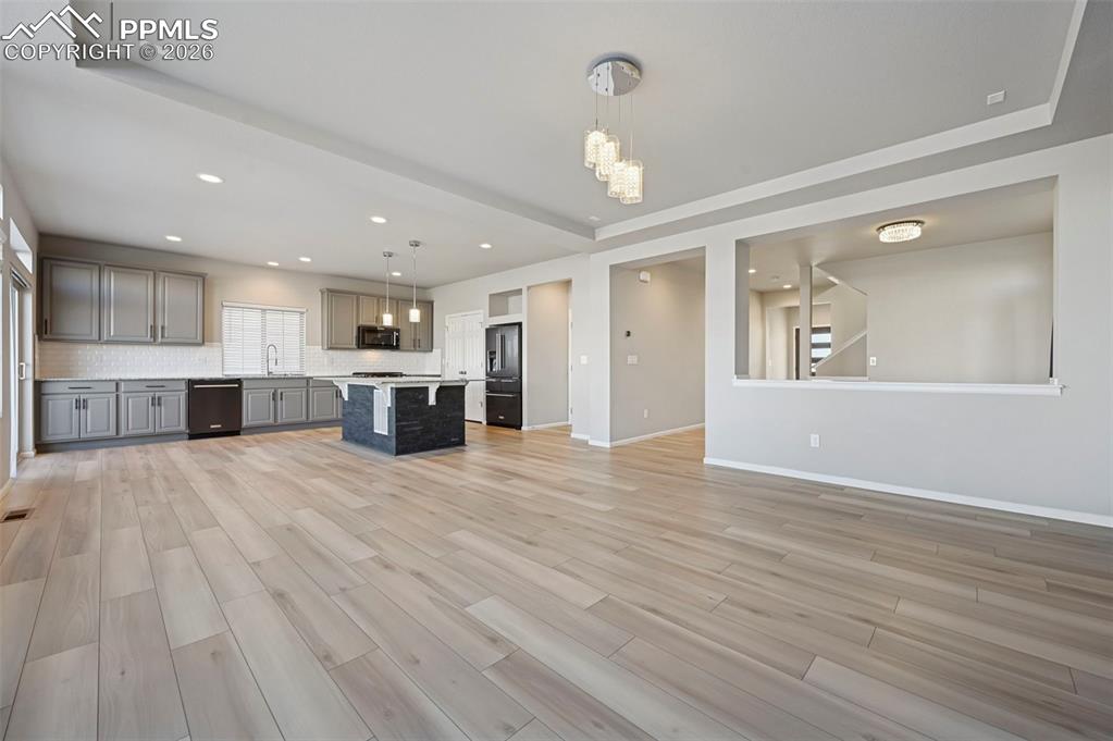 6640 Backcountry Loop Colorado Springs, CO 80927 - Photo 10 of 49 a view of a kitchen with a sink and a stove top oven