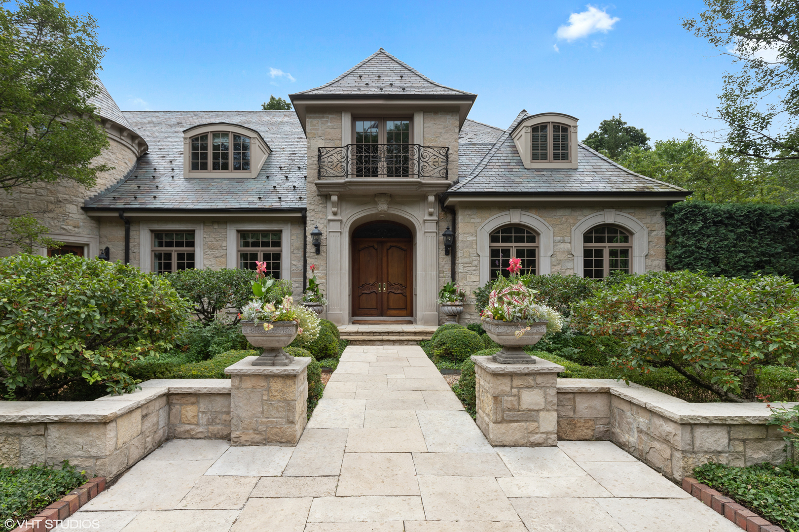 a front view of a house with garden