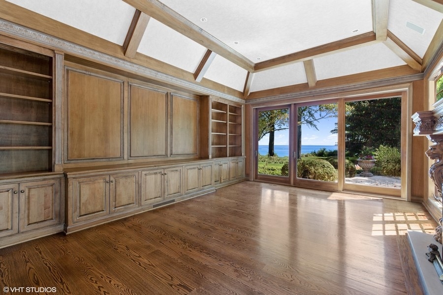 55 Stone Gate Road Lake Forest, IL 60045 - Photo 15 of 62 a view of an entryway with wooden floor and door