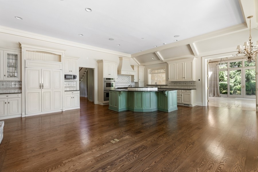 55 Stone Gate Road Lake Forest, IL 60045 - Photo 20 of 62 a kitchen with a refrigerator and a stove top oven
