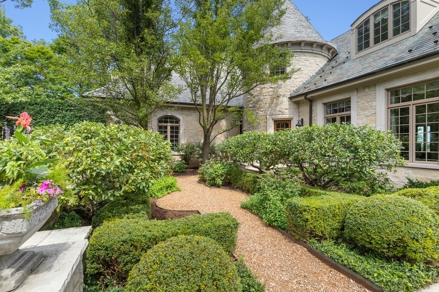 55 Stone Gate Road Lake Forest, IL 60045 - Photo 3 of 62 a view of a house with a yard and garden