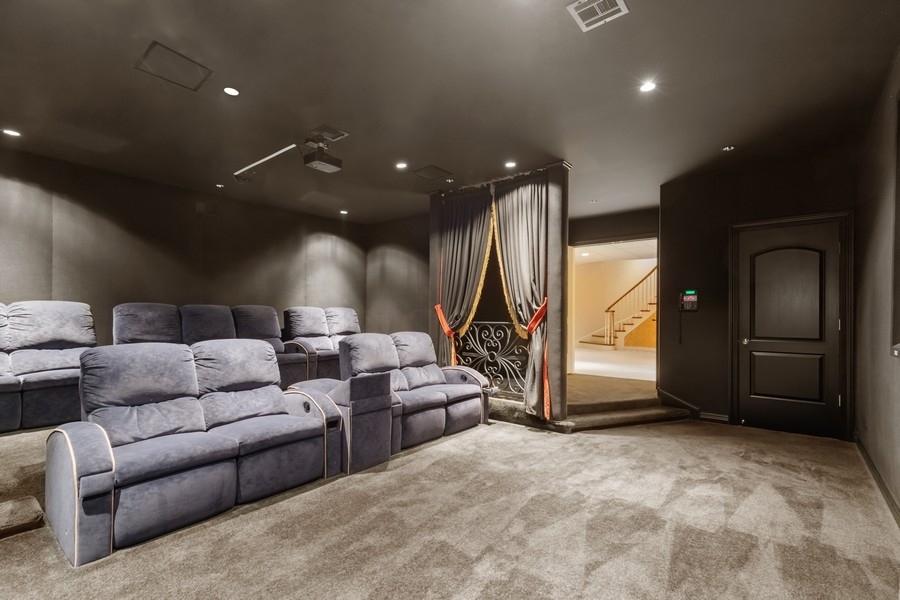 55 Stone Gate Road Lake Forest, IL 60045 - Photo 45 of 62 a living room with furniture and a flat screen tv