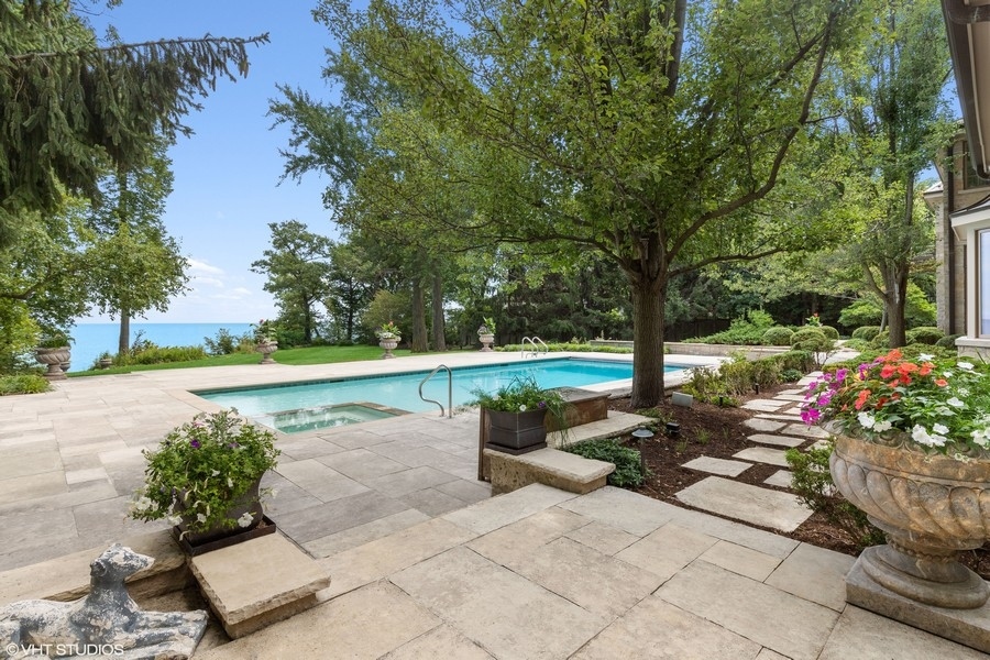 55 Stone Gate Road Lake Forest, IL 60045 - Photo 48 of 62 a view of a swimming pool with a patio