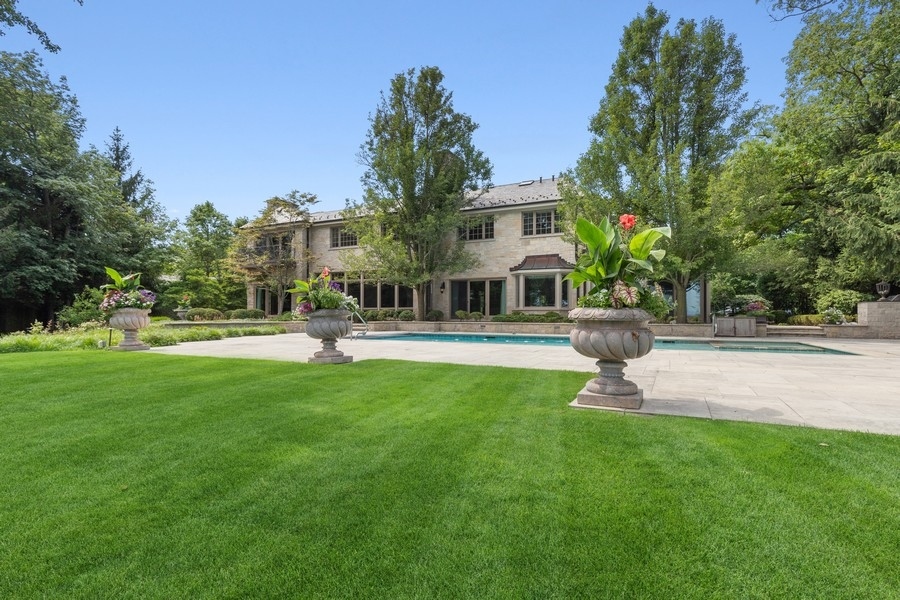 55 Stone Gate Road Lake Forest, IL 60045 - Photo 56 of 62 a front view of a house with garden and trees