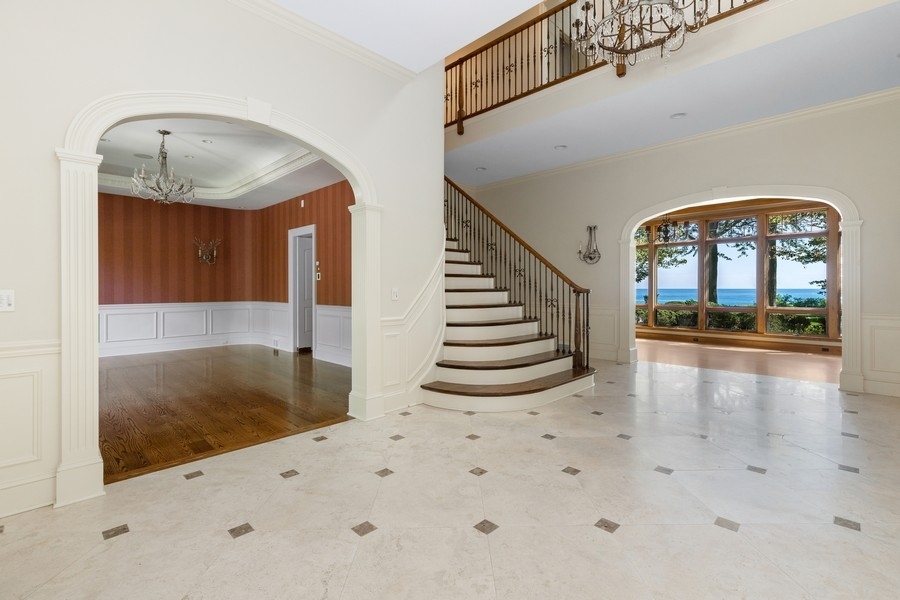 55 Stone Gate Road Lake Forest, IL 60045 - Photo 9 of 62 a view of entryway and hall with wooden floor