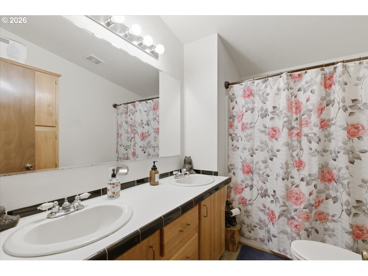 35377 Ede Road Lebanon, OR 97355 - Photo 24 of 48 a bathroom with a sink and a mirror