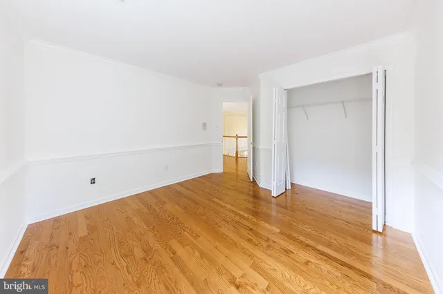 a view of a big room with windows and entryway