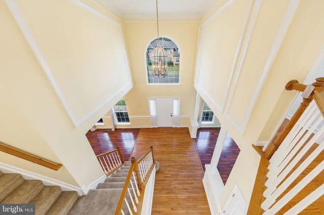 a view of an entryway with wooden floor and door