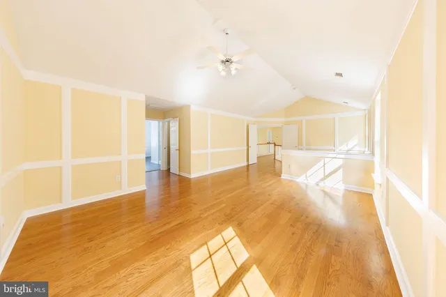 a view of an entryway with wooden floor and a window