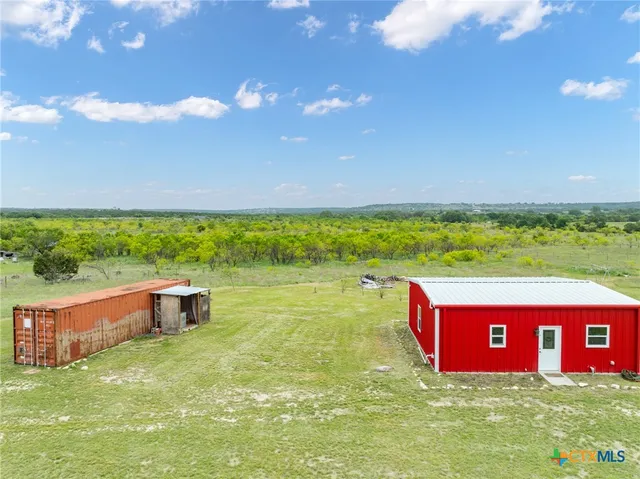 a view of a park with large trees
