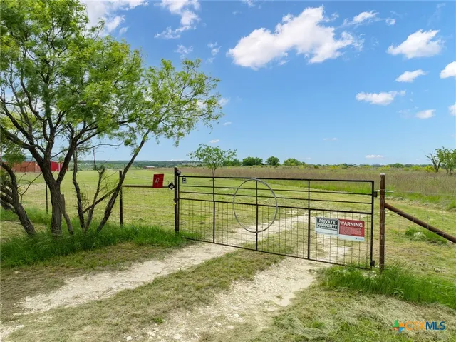 a view of a street with a yard