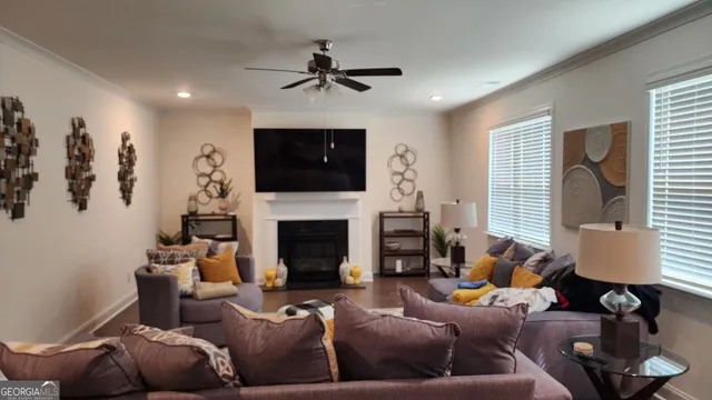 a view of a a dining room with furniture window and wooden floor