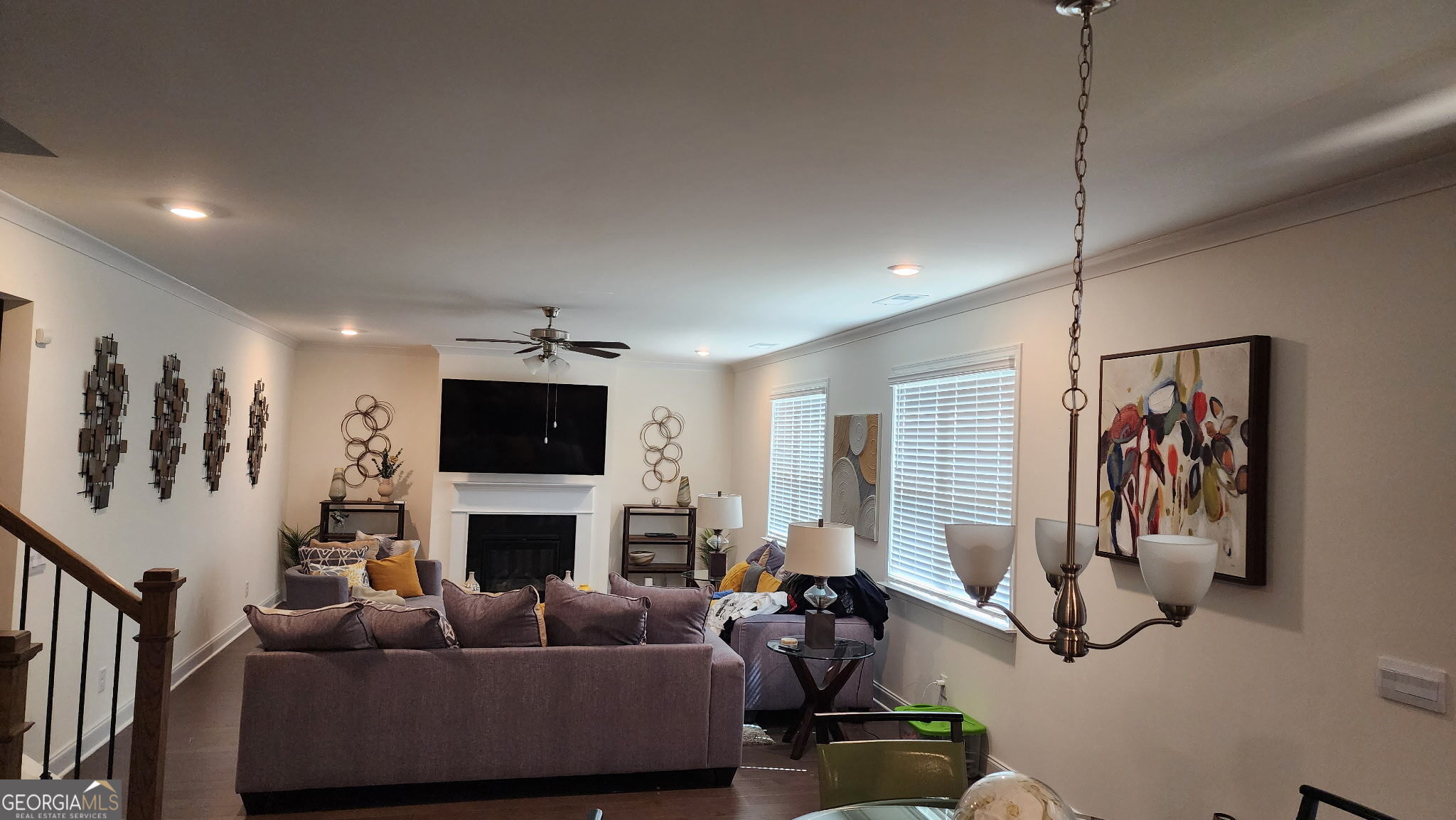 640 Edgar Street Hampton, GA 30228 - Photo 29 of 86 a living room with furniture a flat screen tv and a fireplace