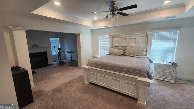 a living room with furniture fireplace and a window