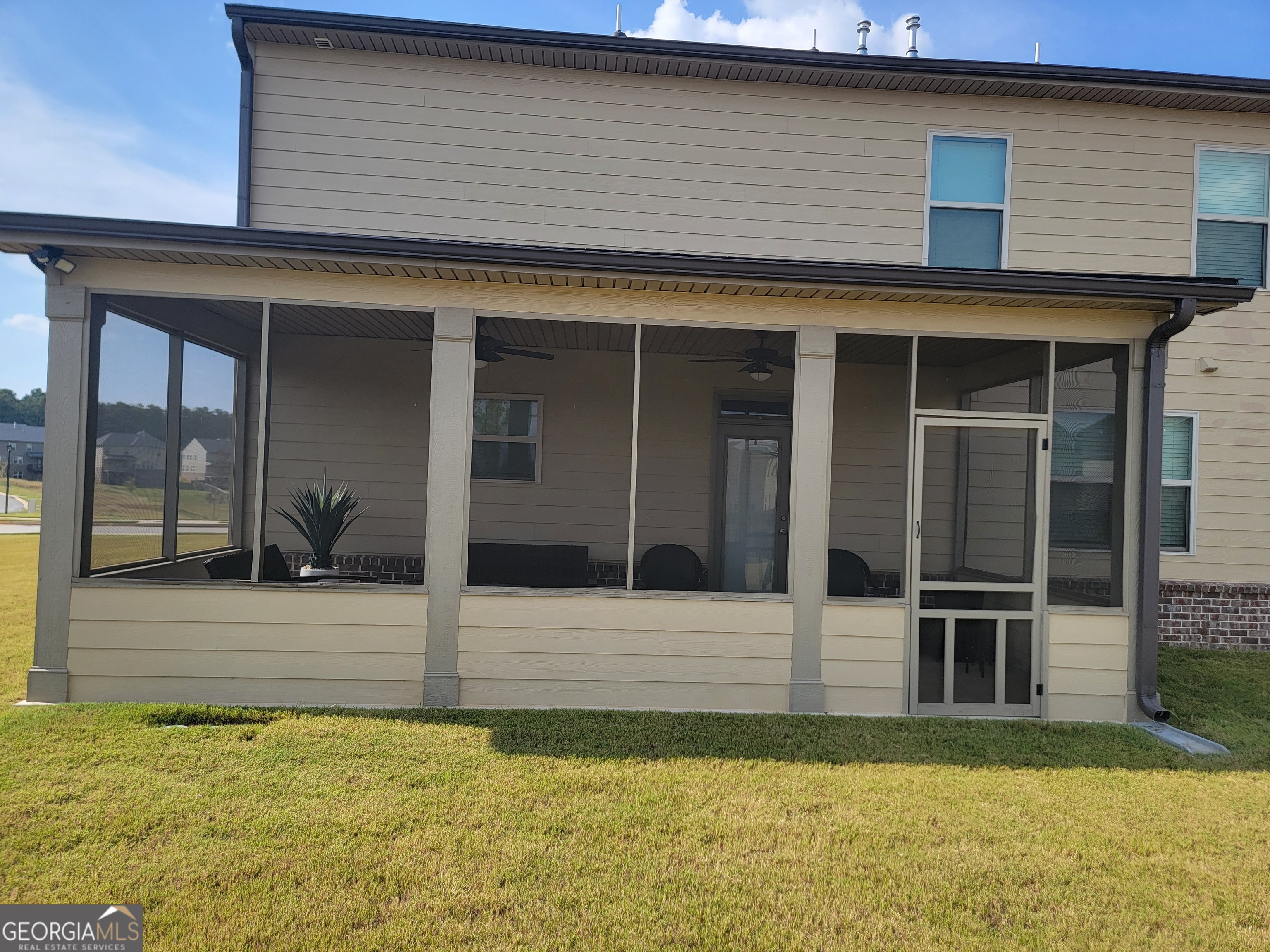 640 Edgar Street Hampton, GA 30228 - Photo 84 of 86 a view of a brick house with a yard