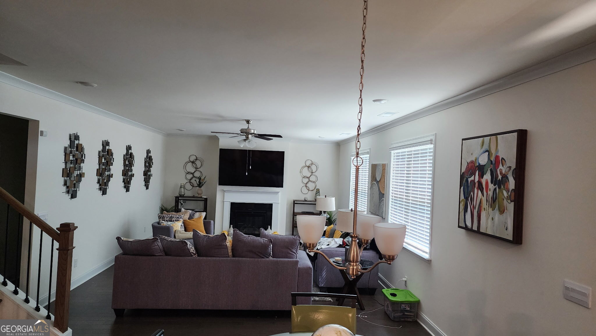 640 Edgar Street Hampton, GA 30228 - Photo 9 of 86 a living room with furniture a flat screen tv and a fireplace