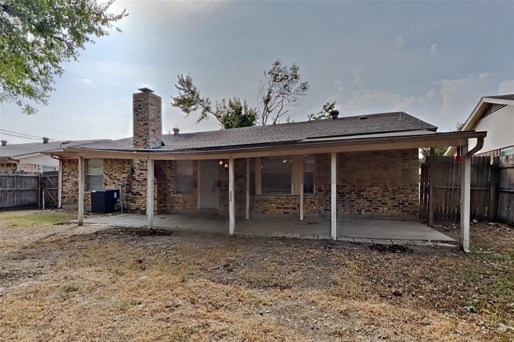 6421 Old Mill Circle Watauga, TX 76148 - Photo 17 of 18 a front view of a house with garden