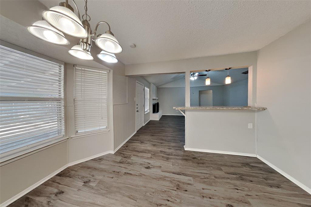 6421 Old Mill Circle Watauga, TX 76148 - Photo 5 of 18 a view of a hallway with wooden floor and staircase