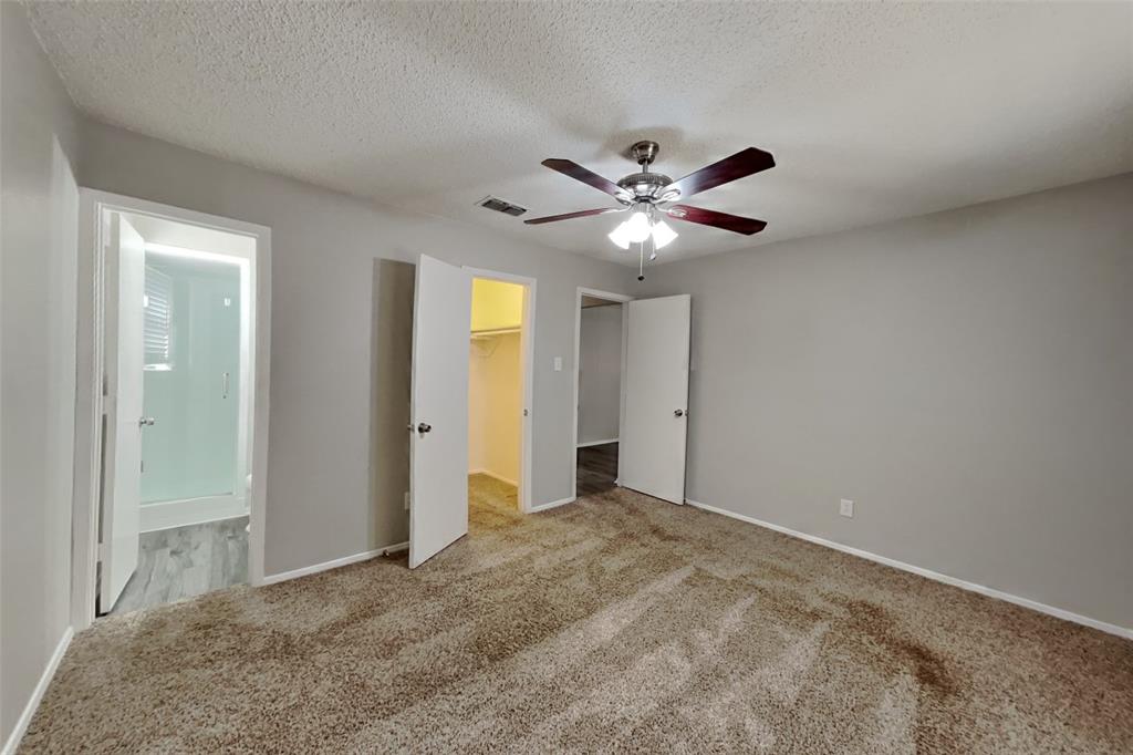 6421 Old Mill Circle Watauga, TX 76148 - Photo 6 of 18 an empty room with fan and a chandelier fan
