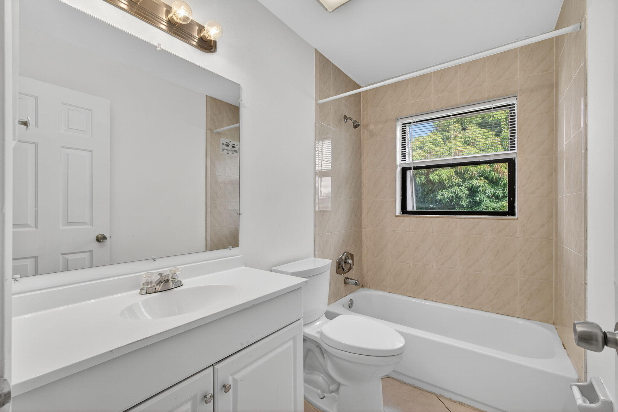 1580 Montauk Drive, Unit 1582 Wellington, FL 33414 - Photo 13 of 28 a bathroom with a sink a toilet and shower