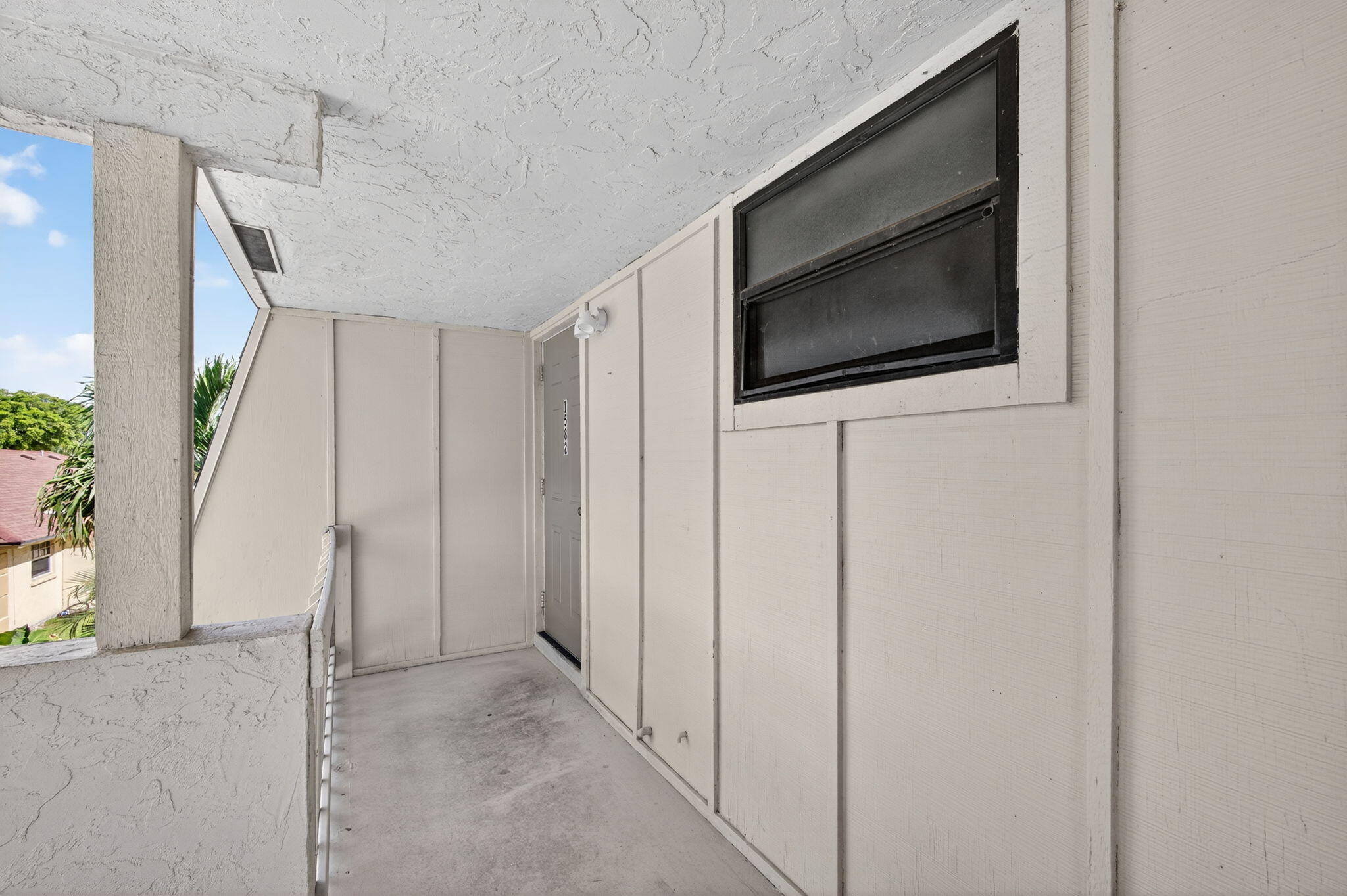 1580 Montauk Drive, Unit 1582 Wellington, FL 33414 - Photo 2 of 28 a view of a livingroom with an empty space and a window