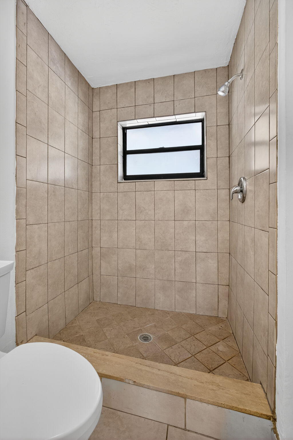 1580 Montauk Drive, Unit 1582 Wellington, FL 33414 - Photo 23 of 28 a bathroom with a toilet and shower
