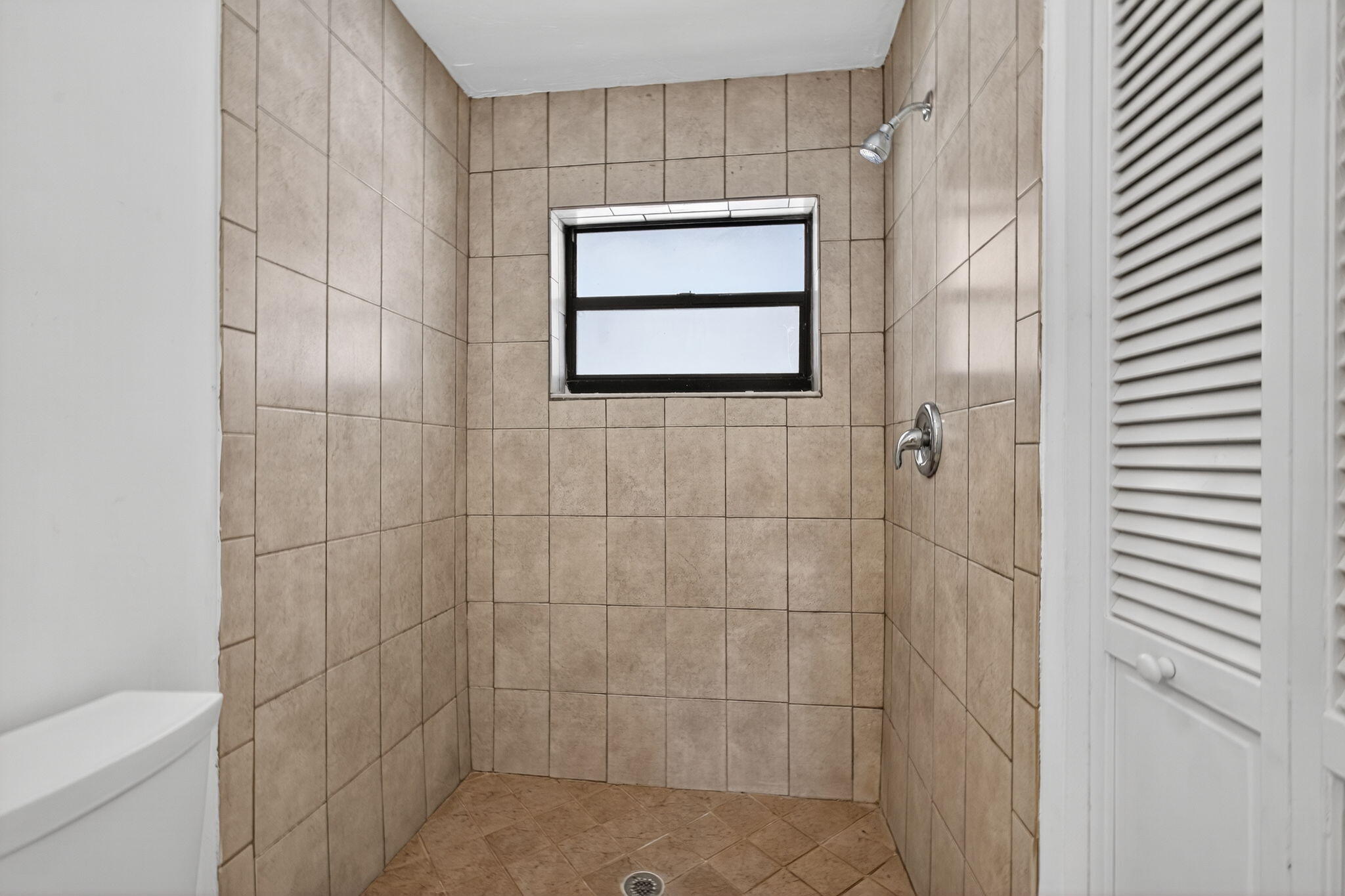 1580 Montauk Drive, Unit 1582 Wellington, FL 33414 - Photo 24 of 28 a bathroom with a shower and a toilet