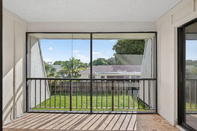 a view of balcony with wooden floor