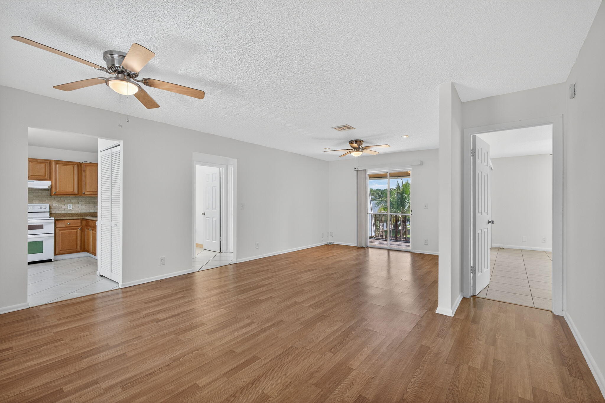1580 Montauk Drive, Unit 1582 Wellington, FL 33414 - Photo 4 of 28 a view of empty room with wooden floor and fan