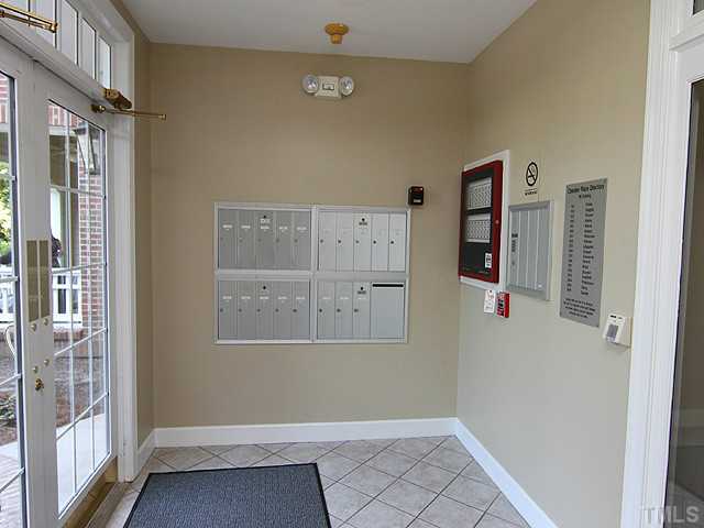 100 Northbrook Drive, Unit 103 Raleigh, NC 27609 - Photo 2 of 4 an empty room with windows