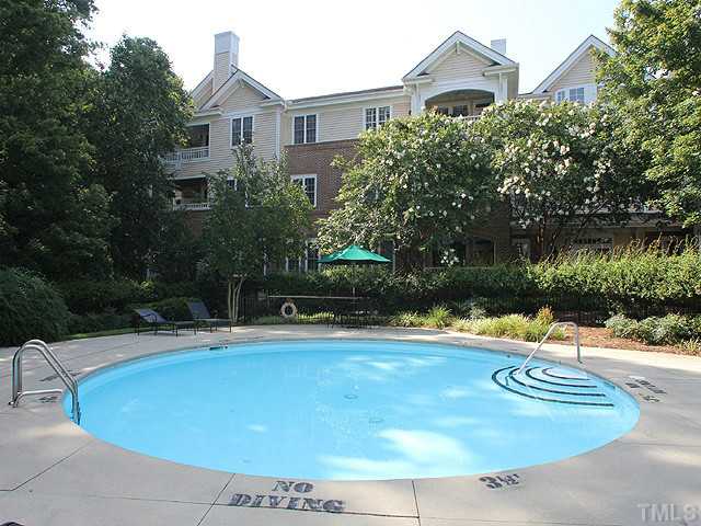 100 Northbrook Drive, Unit 103 Raleigh, NC 27609 - Photo 4 of 4 a view of a house with yard and swimming pool