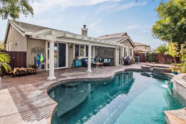 a view of a patio with couches chairs and potted plants